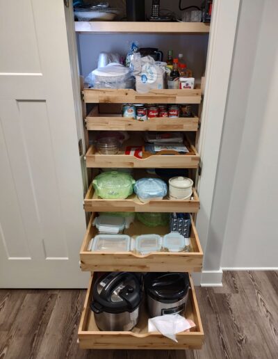 Keep your pantry organized with a custom slide out shelf solution.
