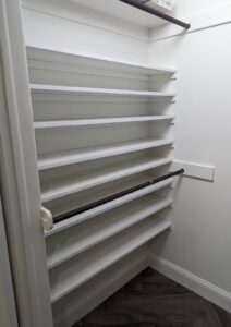 Shoe shelves in existing small walk-in master closet